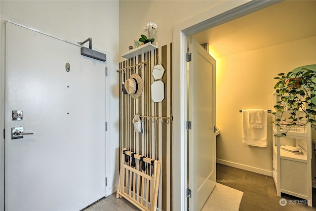 corridor featuring hardwood / wood-style floors