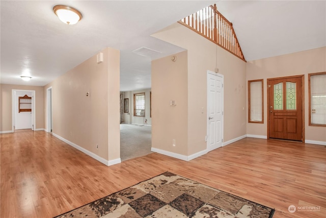 entryway featuring light wood finished floors and baseboards