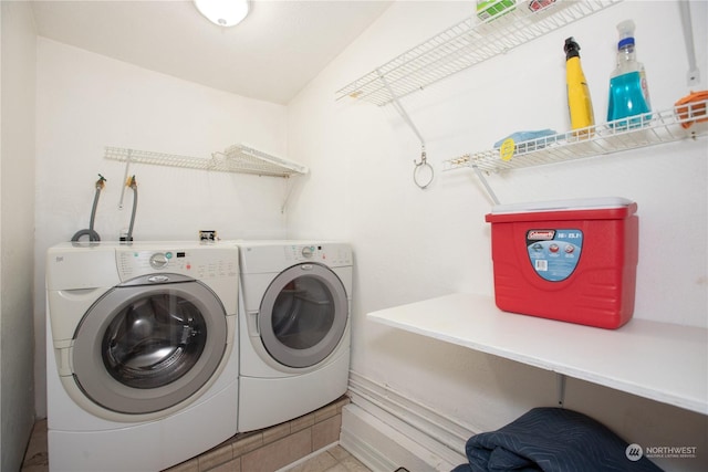 laundry room featuring independent washer and dryer, laundry area, baseboards, and tile patterned flooring