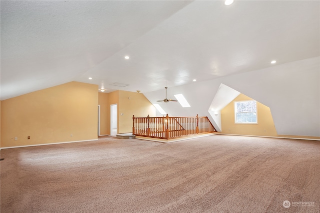 additional living space featuring lofted ceiling, ceiling fan, and carpet floors