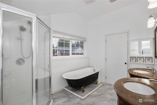 full bathroom featuring vanity, marble finish floor, a stall shower, and a soaking tub