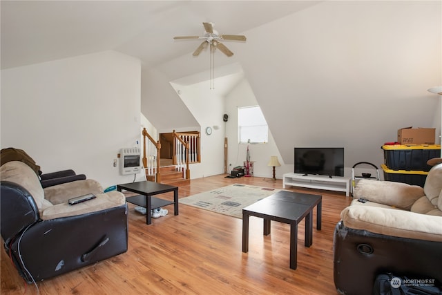 living room featuring ceiling fan, vaulted ceiling, heating unit, and hardwood / wood-style floors