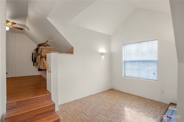 interior space featuring light hardwood / wood-style flooring, lofted ceiling, and ceiling fan