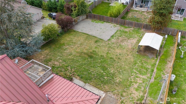 view of yard featuring an outbuilding and a fenced backyard