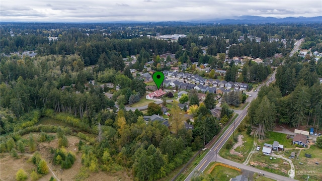 birds eye view of property with a mountain view