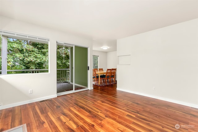 spare room with hardwood / wood-style floors