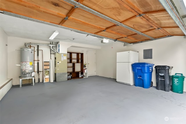 garage with water heater, heating unit, white refrigerator, a garage door opener, and electric panel