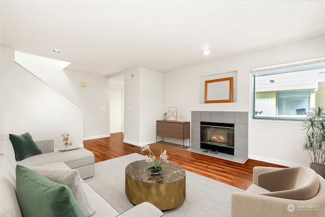 living room featuring hardwood / wood-style flooring and a fireplace