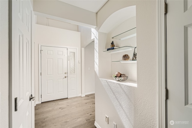 hall with light wood-type flooring