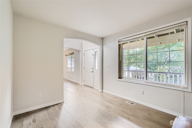 spare room with light hardwood / wood-style flooring