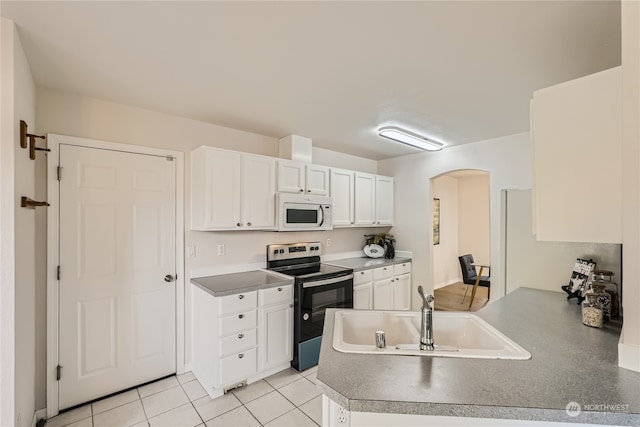 kitchen featuring white cabinetry, electric stove, kitchen peninsula, light tile patterned floors, and sink