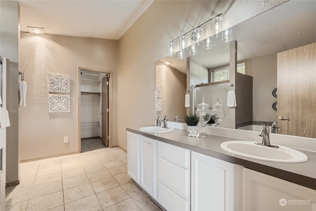 bathroom with vanity and tile patterned floors