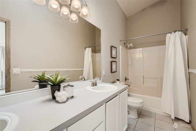 full bathroom with vanity, toilet, shower / bath combo with shower curtain, and tile patterned floors