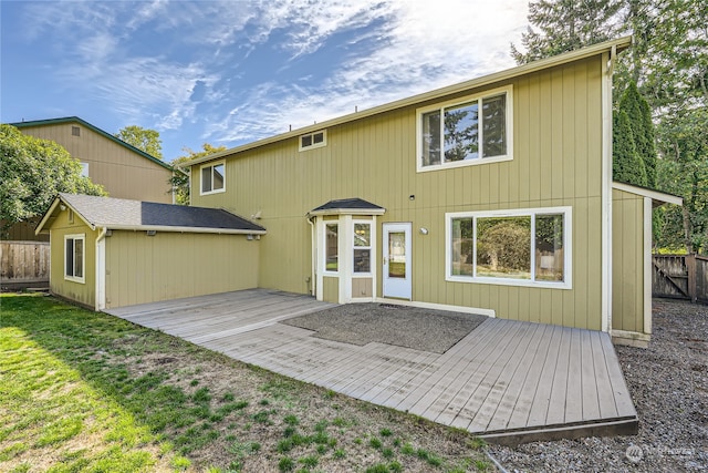 rear view of house featuring a deck