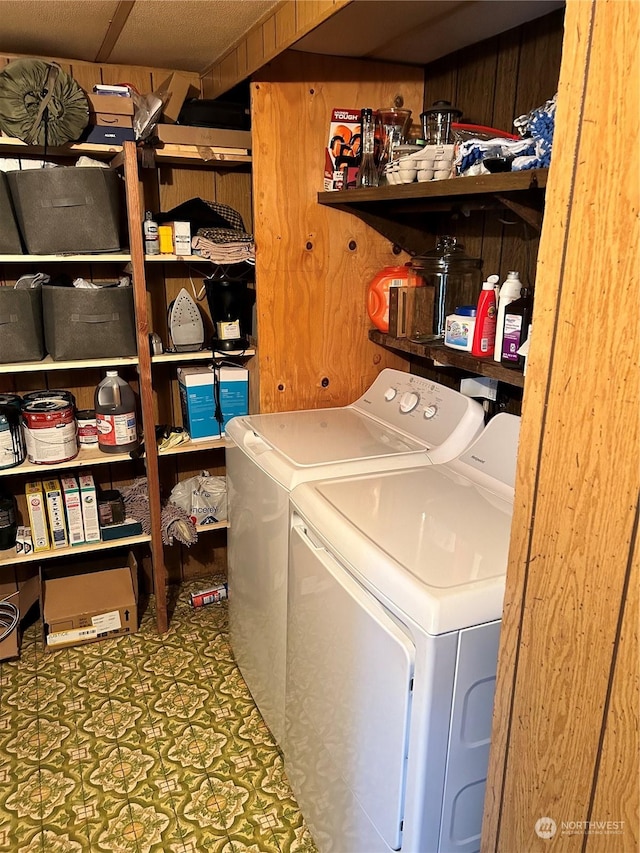 464A Peters Rd, Randle, WA 98377 - clothes washing area featuring laundry area, wood walls, and washing machine and clothes dryer