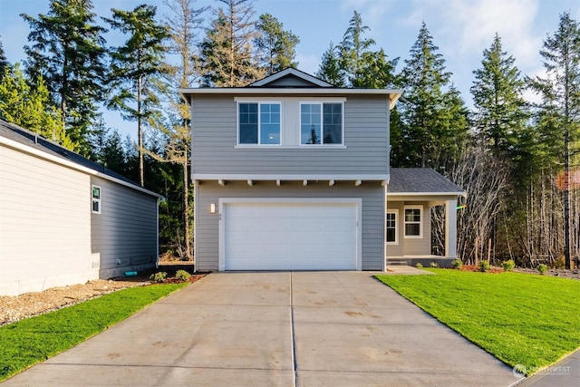 front of property with a garage and a front lawn