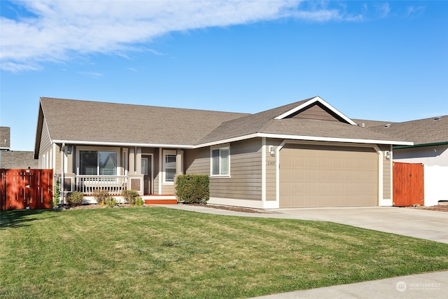 ranch-style home with a front lawn, covered porch, and a garage