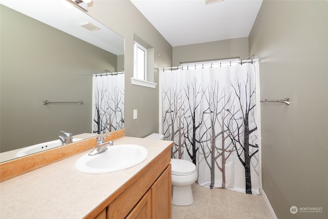 bathroom with vanity, toilet, tile patterned floors, and a shower with curtain