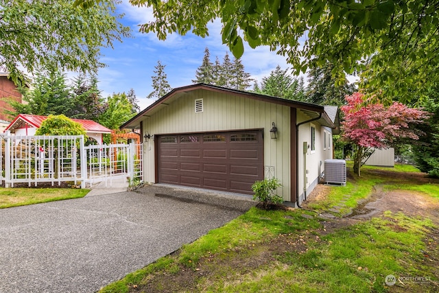 garage with wooden walls and central AC unit