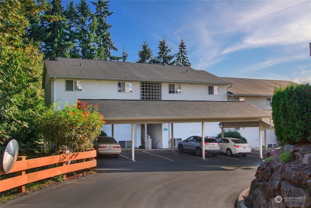 view of vehicle parking with a carport