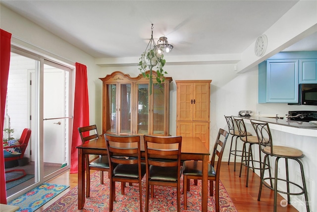 dining space featuring light wood-style flooring