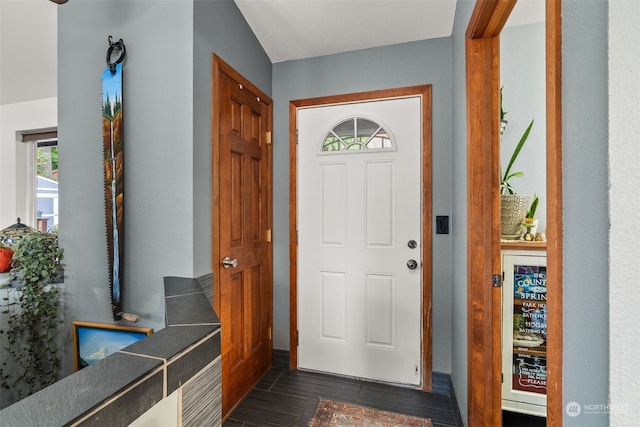 entryway with dark wood-type flooring