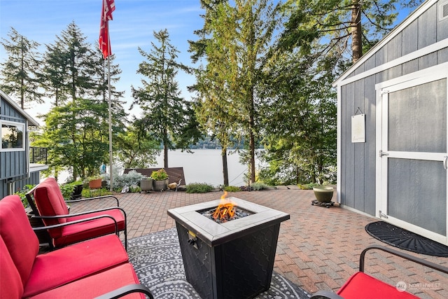 view of patio with a fire pit