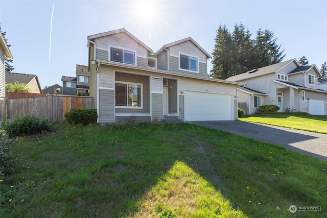 view of front of property with a front lawn and a garage