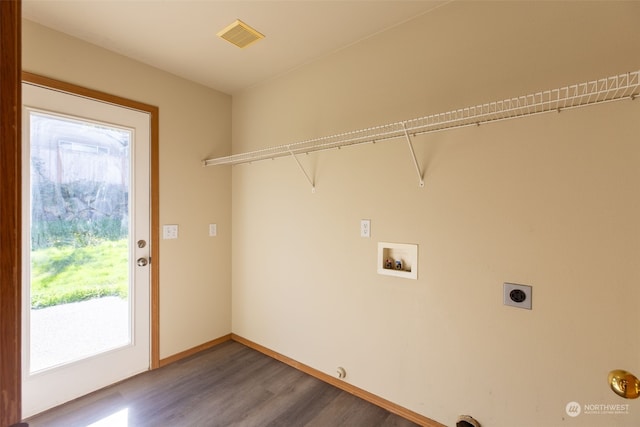 laundry area with washer hookup, hookup for a gas dryer, hardwood / wood-style floors, and electric dryer hookup