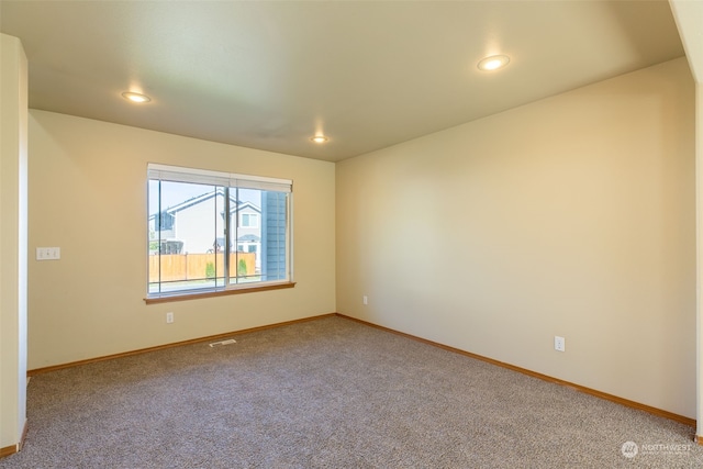 empty room featuring carpet flooring