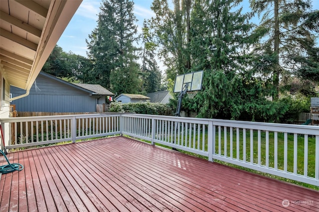 wooden terrace with a lawn