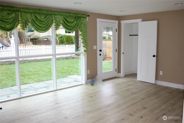 doorway to outside featuring light hardwood / wood-style floors