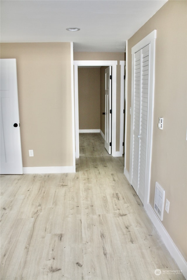 hallway featuring light wood-type flooring