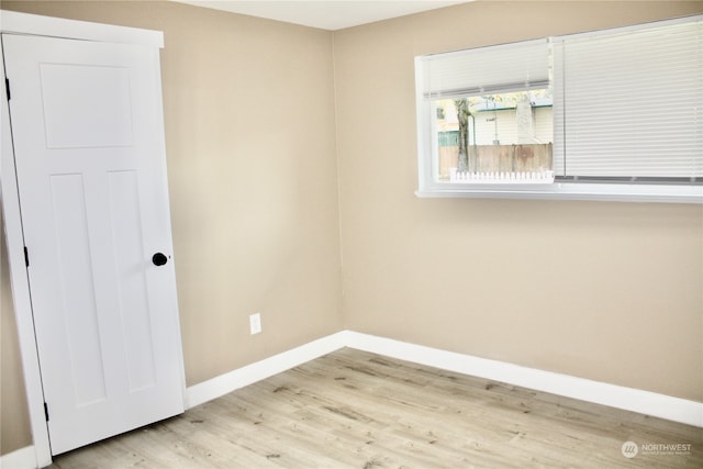 spare room featuring light hardwood / wood-style floors