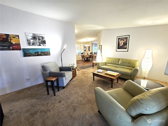 living room with a notable chandelier and hardwood / wood-style floors