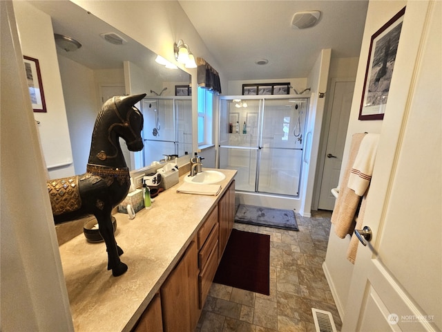 bathroom with vanity and walk in shower