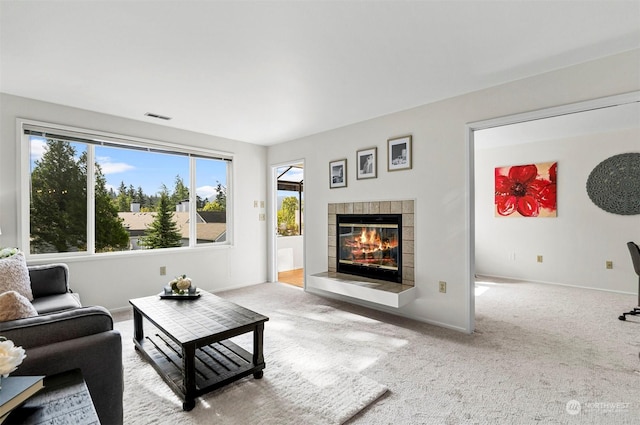 4152 Providence Point Dr SE Unit 207, Issaquah, WA 98029 - carpeted living area with a tile fireplace and baseboards