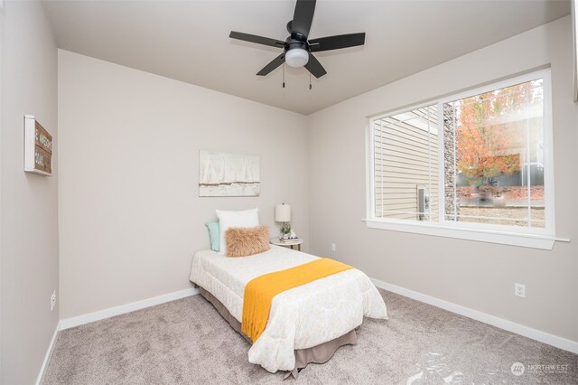 bedroom featuring ceiling fan and light colored carpet