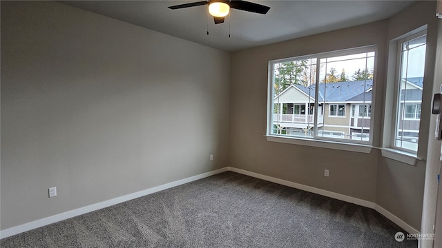 empty room with carpet flooring and ceiling fan