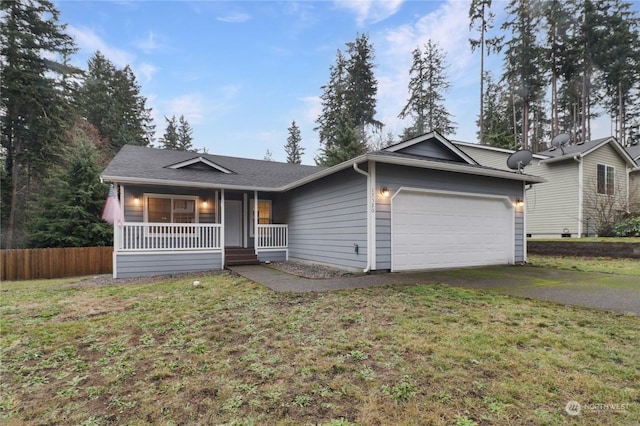 ranch-style house with a porch, a garage, and a front lawn