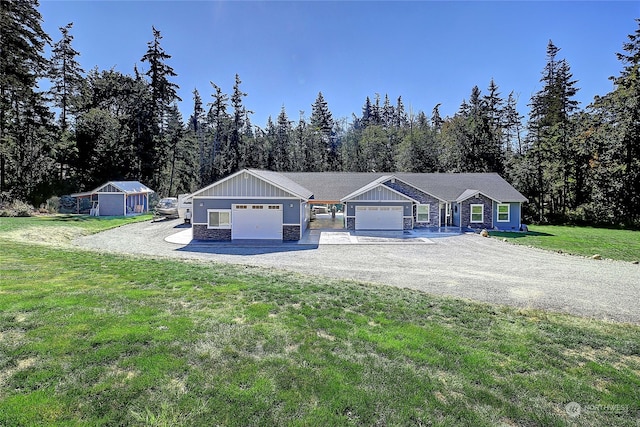 view of front of home with a garage and a front lawn