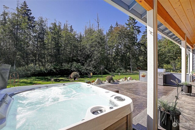 view of patio / terrace featuring a hot tub