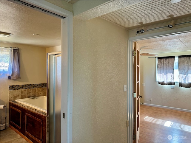 corridor featuring light hardwood / wood-style floors