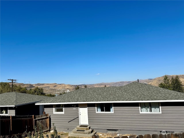 back of house featuring a mountain view