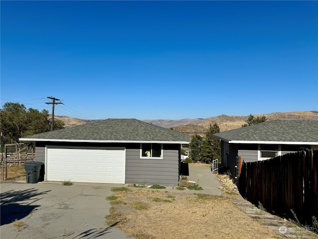 view of home's exterior featuring a mountain view and a garage