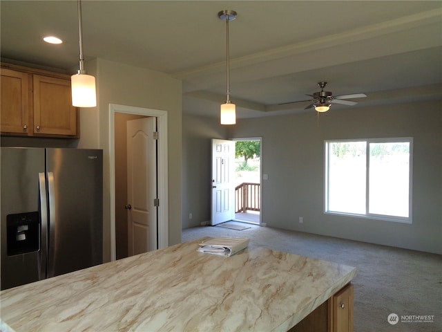 kitchen with ceiling fan, light colored carpet, hanging light fixtures, and stainless steel fridge