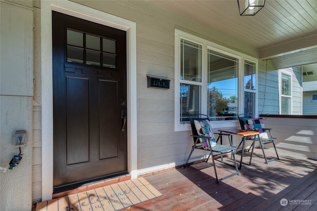 property entrance with covered porch