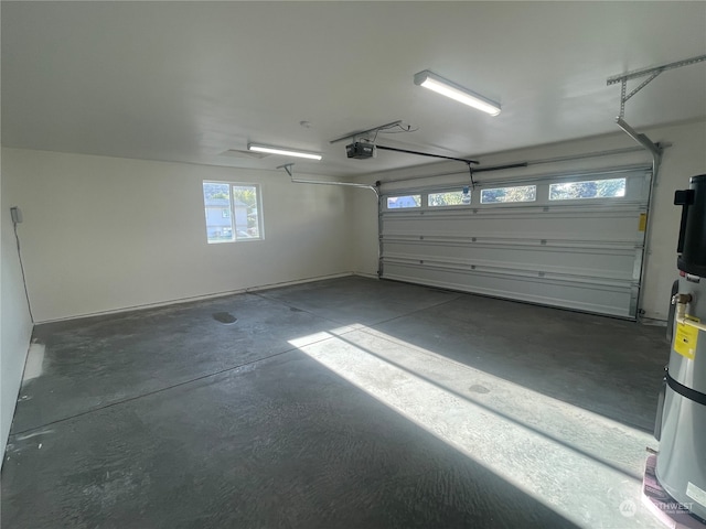 garage with a garage door opener and secured water heater