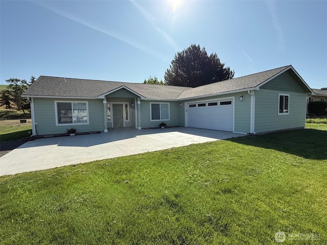 1507 S 5th St, Dayton, WA 99328 - single story home with a garage, a front yard, concrete driveway, and roof with shingles