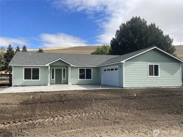 1507 S 5th St, Dayton, WA 99328 - ranch-style house with a garage and roof with shingles